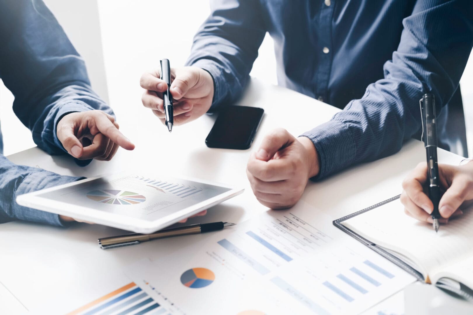 Business team reviewing charts and financial reports