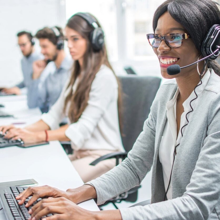 A group of people working in a call center.